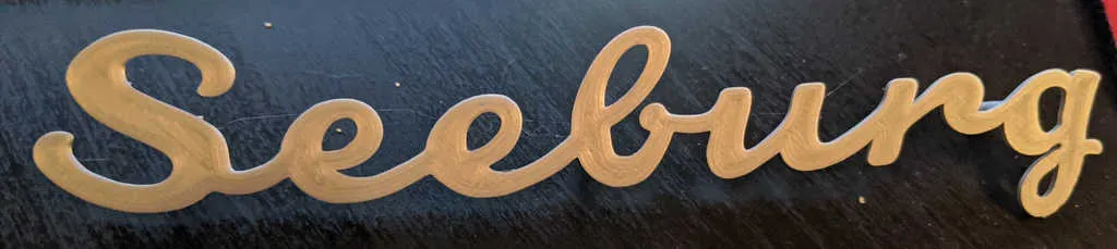 Biểu tượng loa giọt nước Seeburg với chốt gắn phía sau