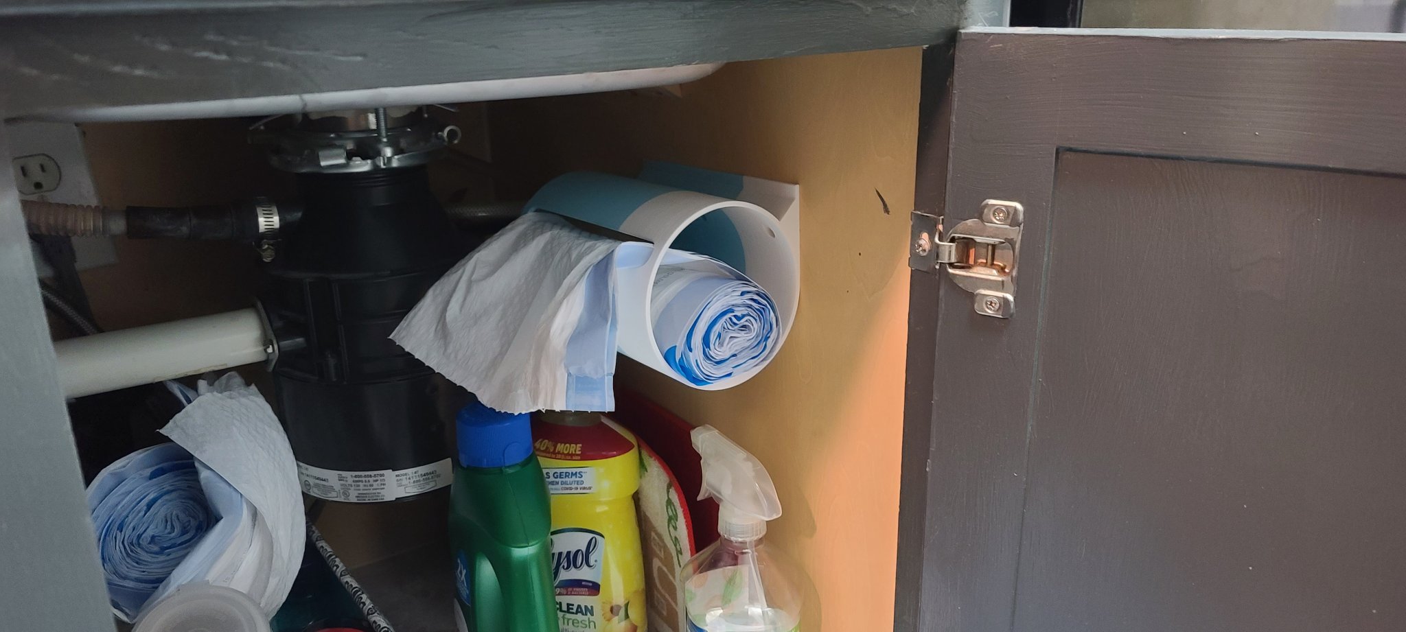 Máy phân phối túi rác gắn bên hông tủ đựng đồ