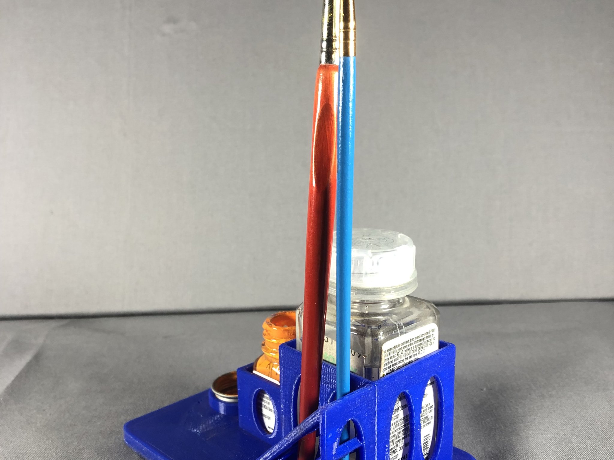 Giá đỡ lọ sơn mô hình Testors với chỗ để nắp và cọ vẽ