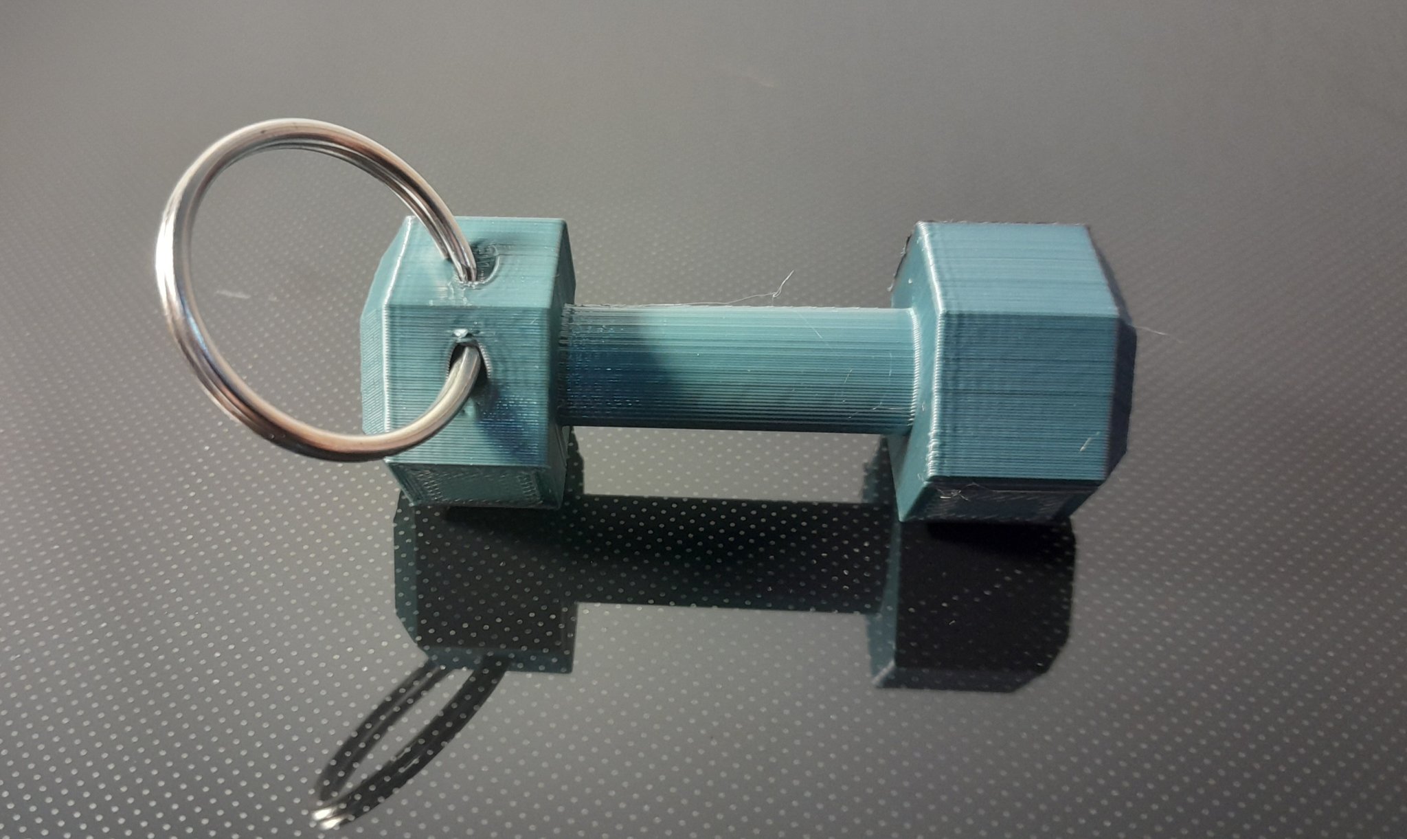 Móc khóa tạ tay tiện lợi cho người yêu thể thao