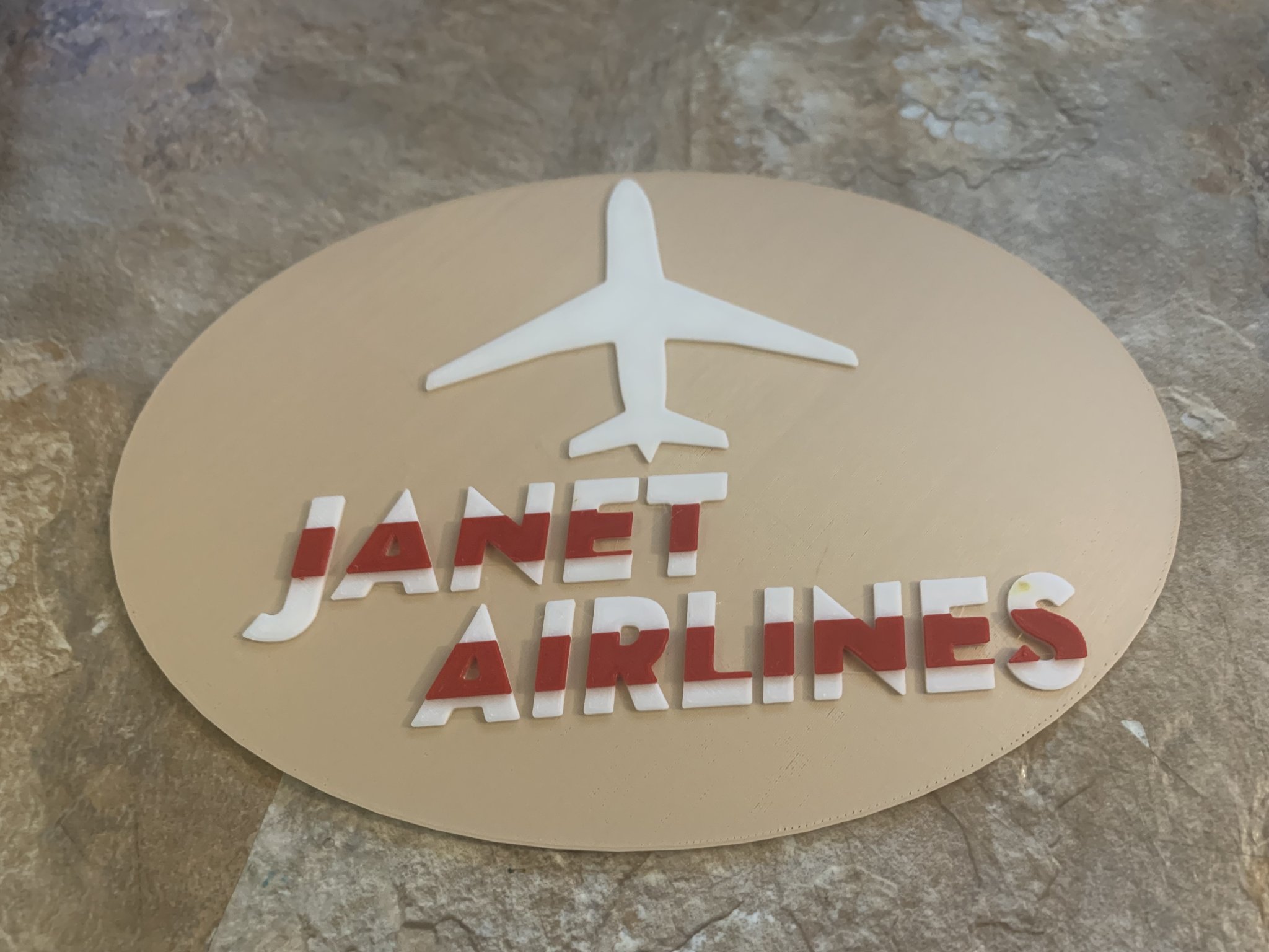 Biểu tượng hàng không Janet Airlines phong cách retro 1980