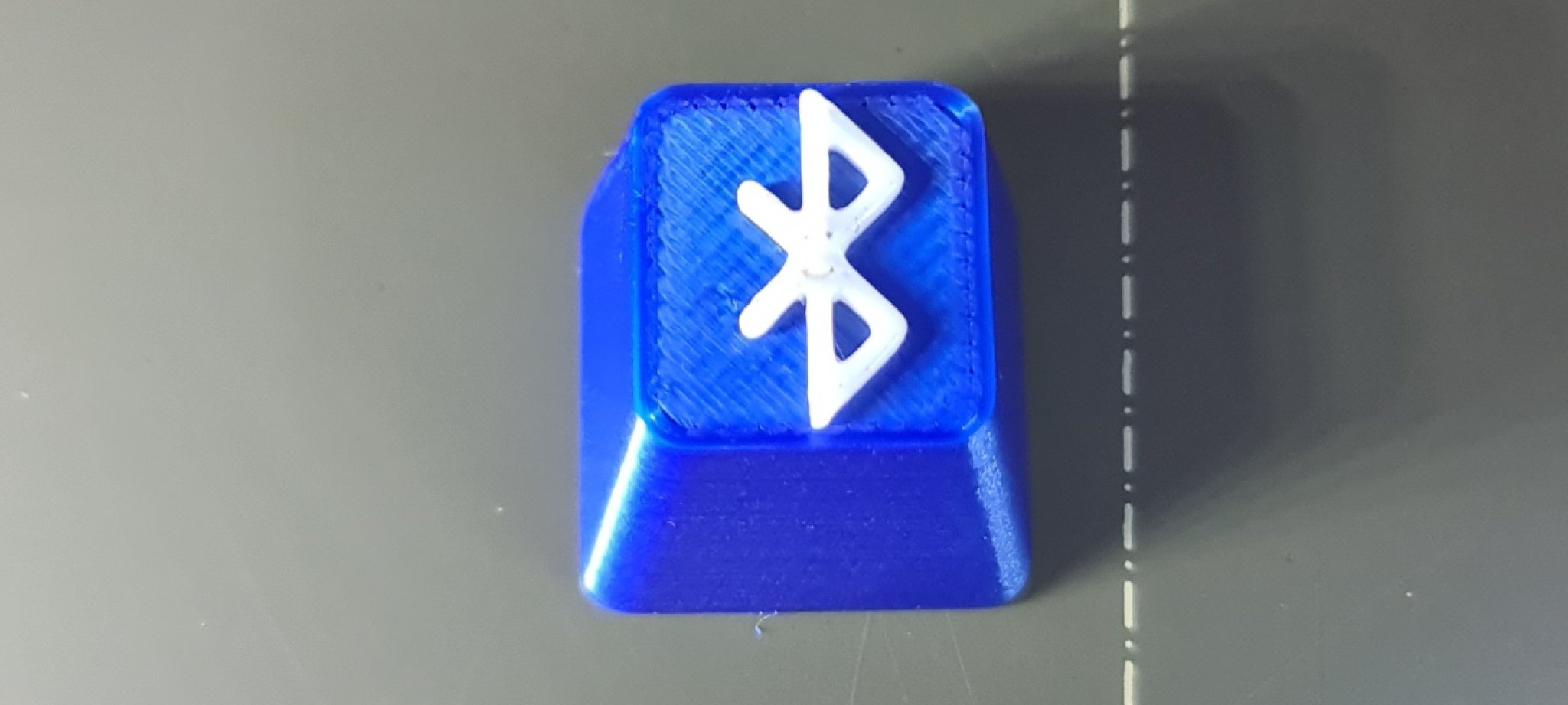 Nút bấm Bluetooth in màu xanh và trắng