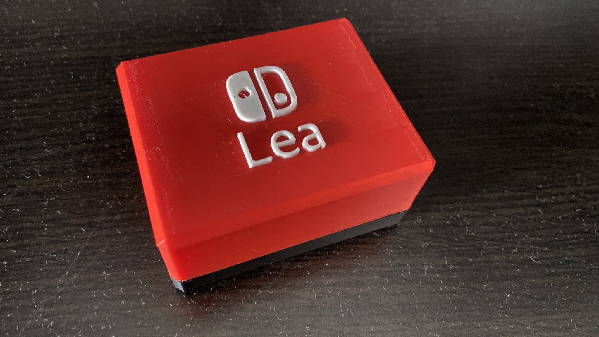 Hộp trò chơi Switch 6x3 với nametag và logo switch