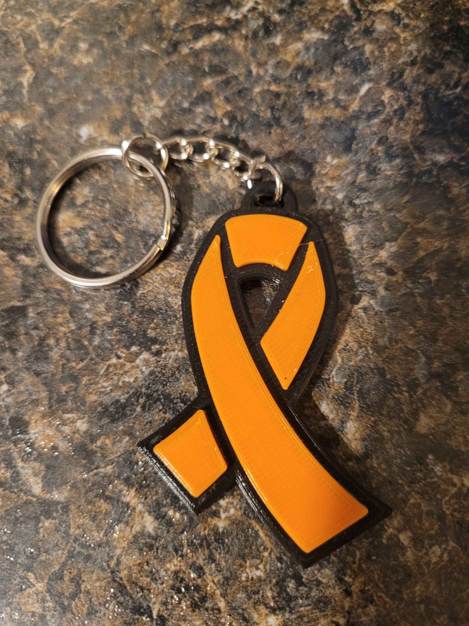 Móc khóa hình ruy băng chống ung thư thiết kế cho từ thiện