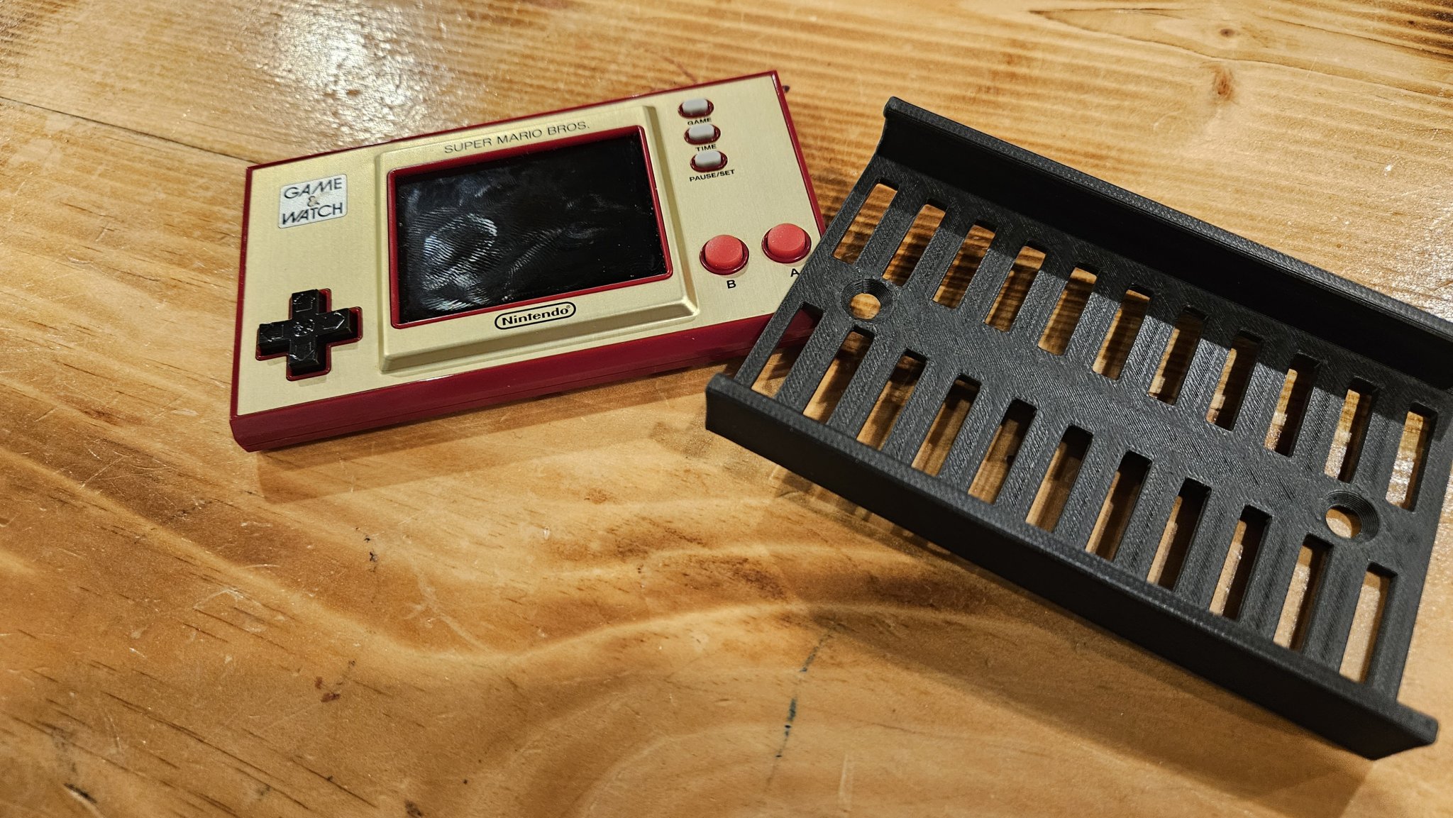 Giá đỡ treo thiết bị Game and Watch của Nintendo