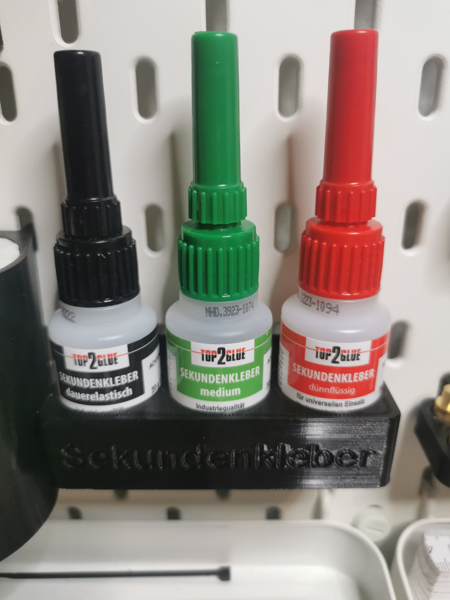 Giá đỡ keo siêu dính cho bảng Skadis 3 chai