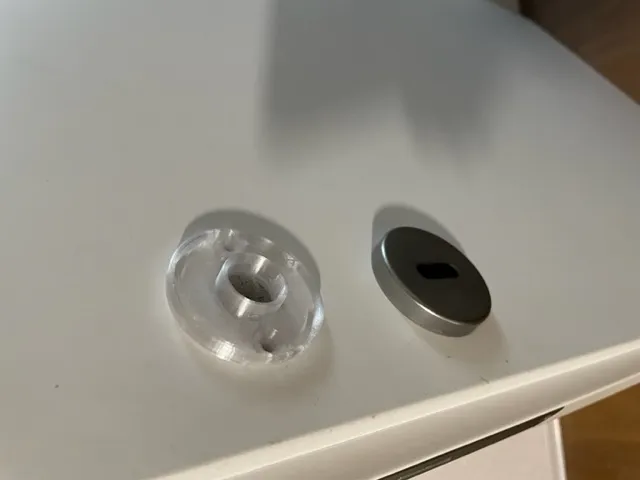 Phụ kiện nhựa dưới rosette cửa bị hỏng cần thay thế