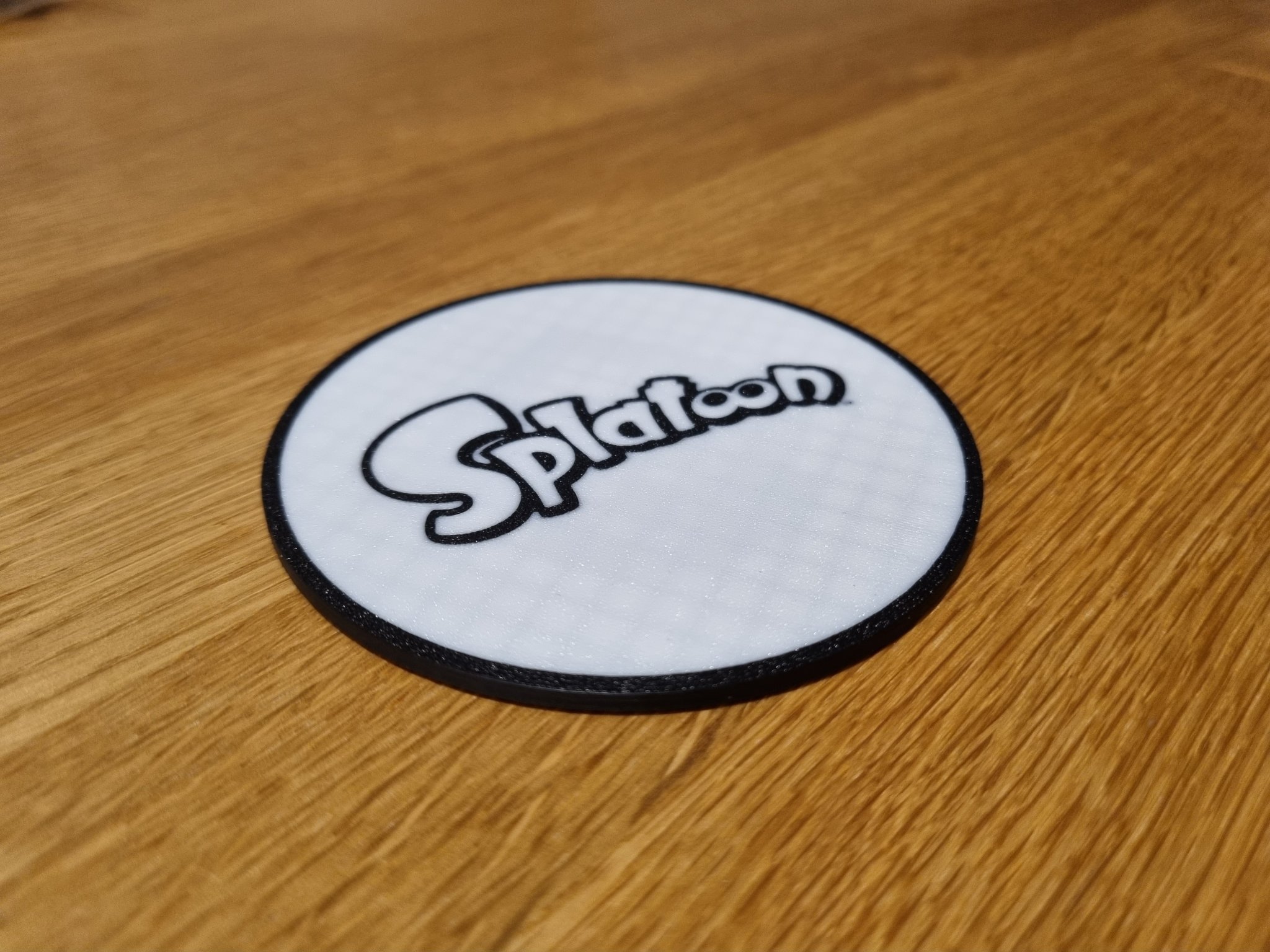 Móc lót ly đôi mặt Splatoon với logo và hình mực