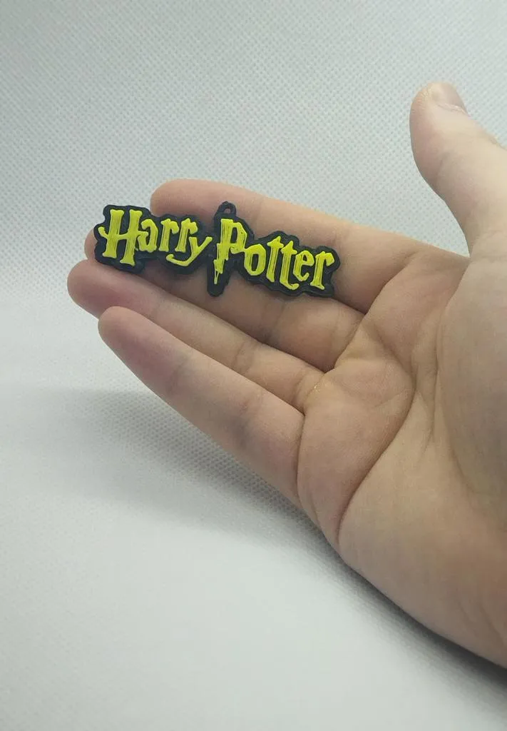 **Móc khóa biểu tượng Harry Potter độc đáo**