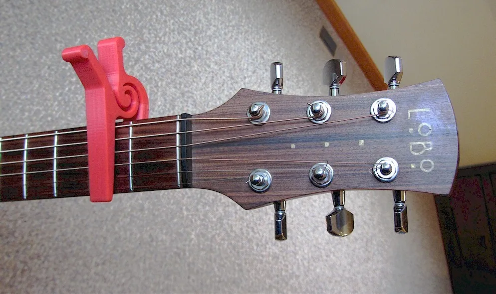 Capo guitar một tay dạng khối duy nhất