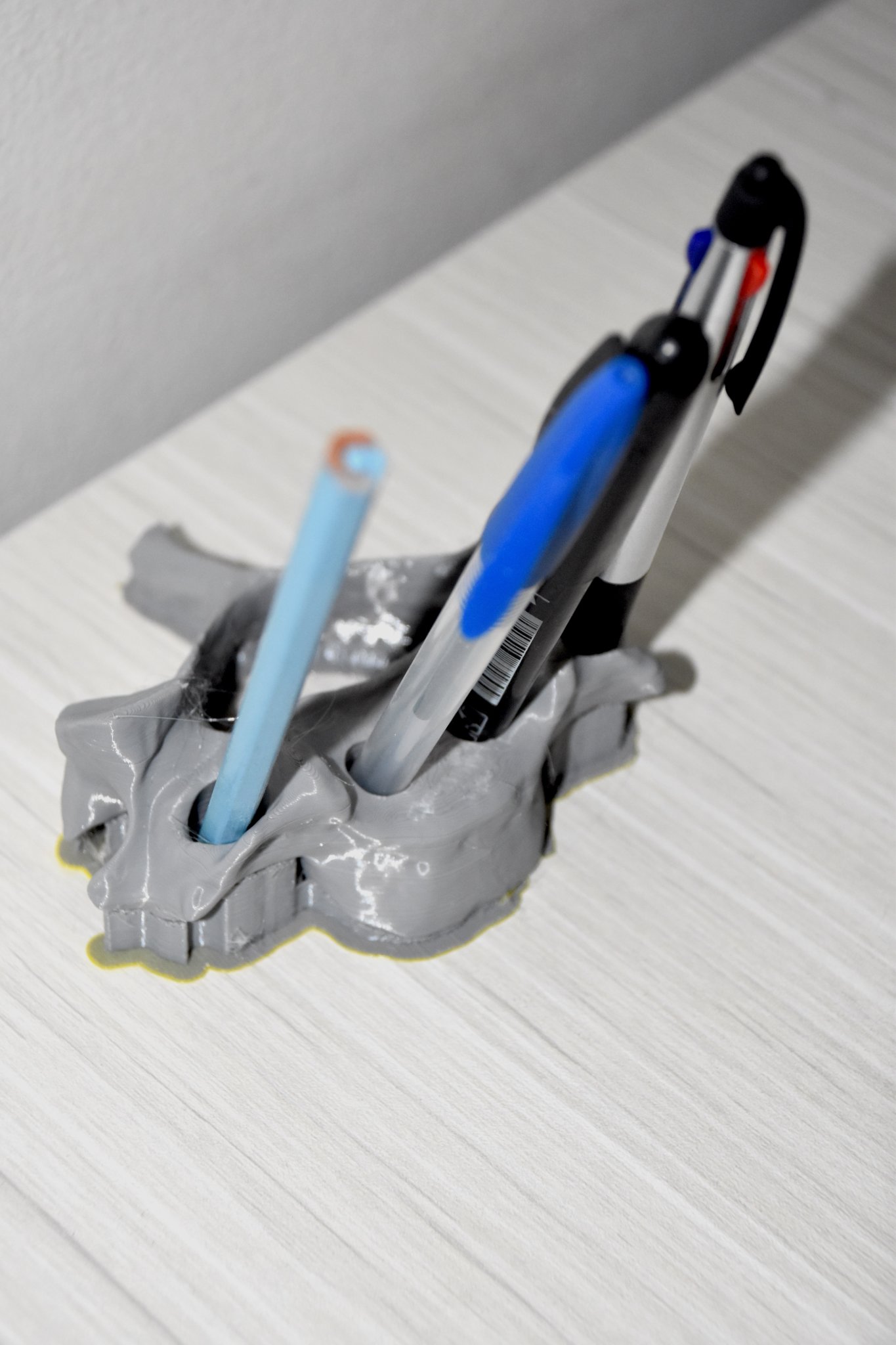 Giá đỡ bút hình đốt sống cổ