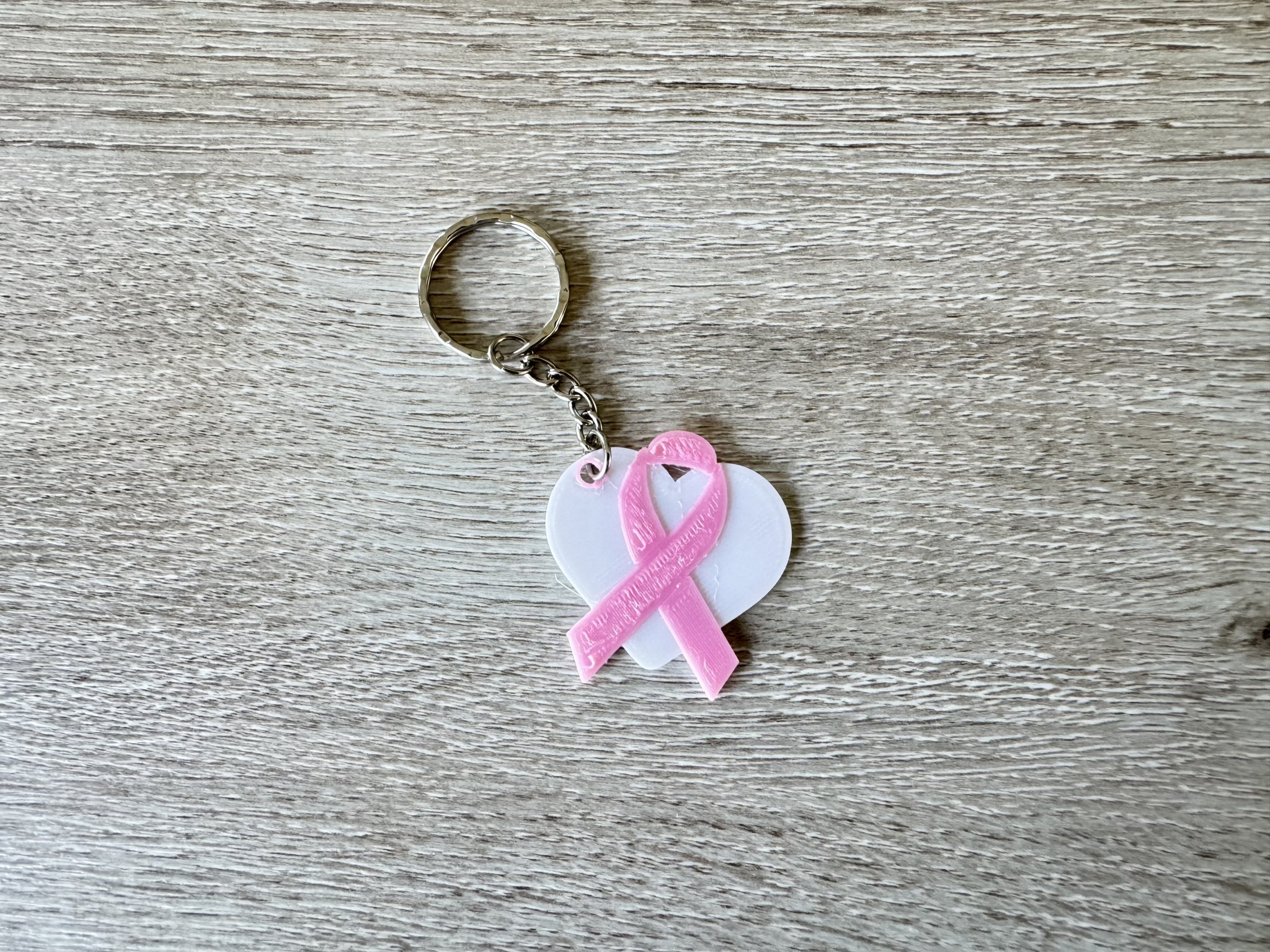 Móc khóa tháng 10 hồng 2023 cho chiến dịch nâng cao nhận thức