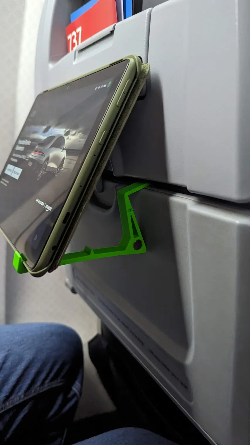 Giá đỡ thiết bị gắn vào bàn ăn trên máy bay