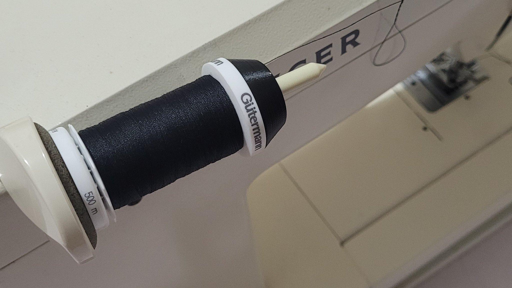 Giá đỡ cuộn chỉ cho máy may Singer