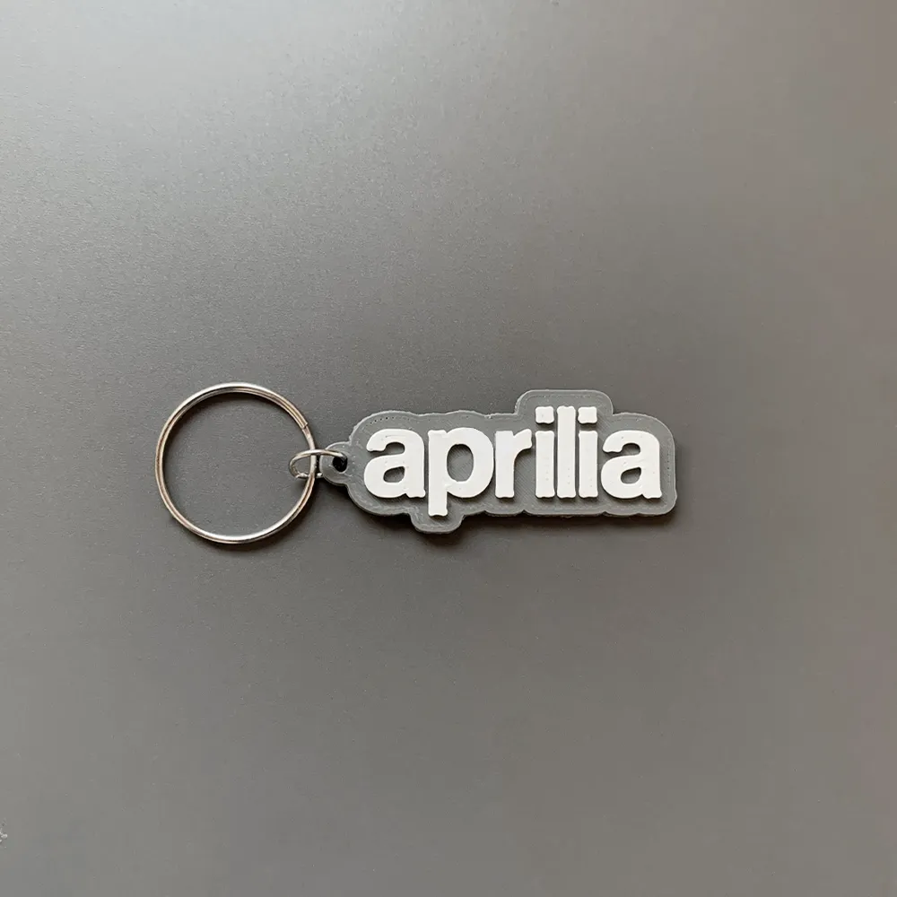 Móc khóa thương hiệu Aprilia in 3D với thiết kế đơn giản