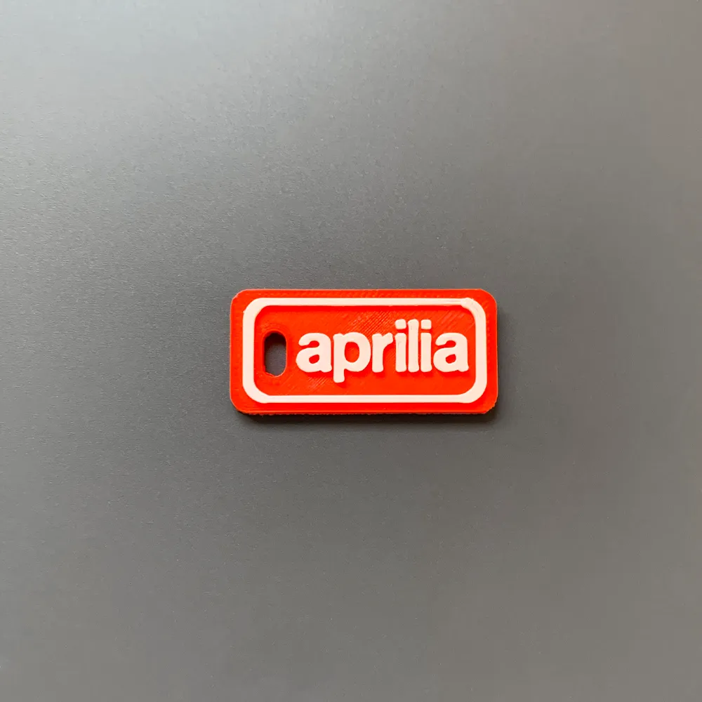 Móc khóa thương hiệu Aprilia in 3D với thiết kế đơn giản