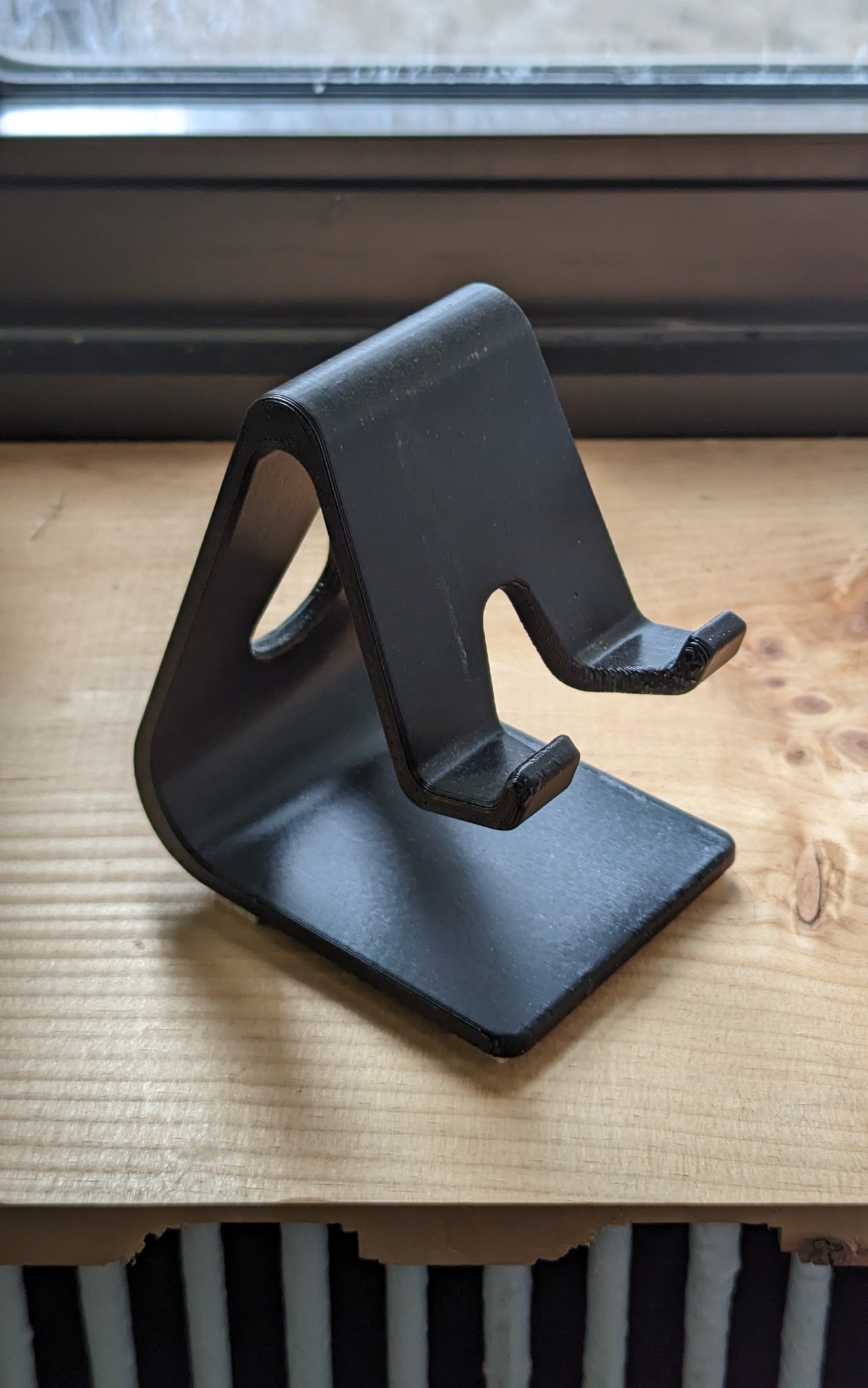 Giá đỡ điện thoại có trọng lượng cho việc sạc và sử dụng