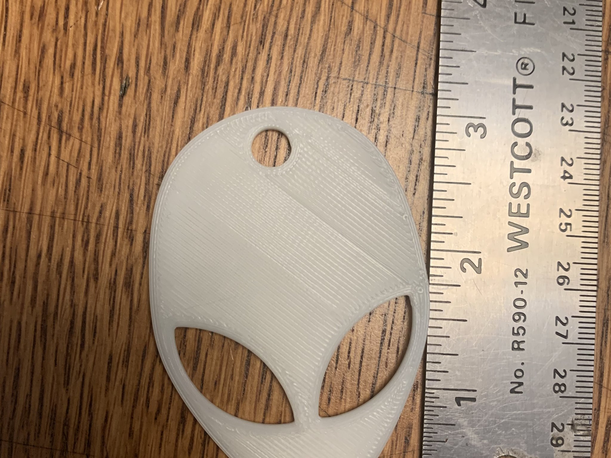 Móc chìa khóa Alien phát sáng trong bóng tối