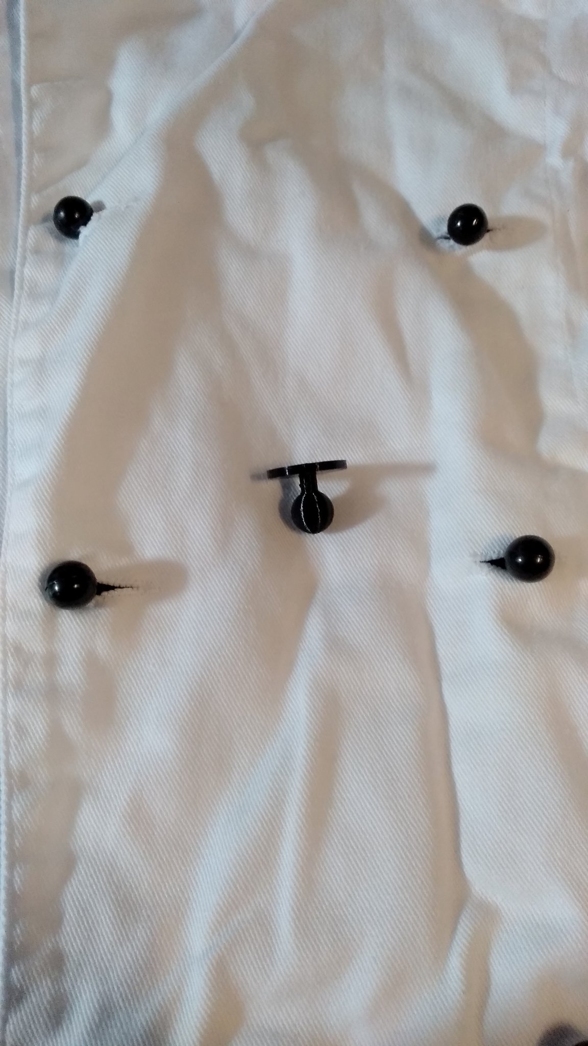 Nút áo cho bếp trưởng trong thiết kế thời trang