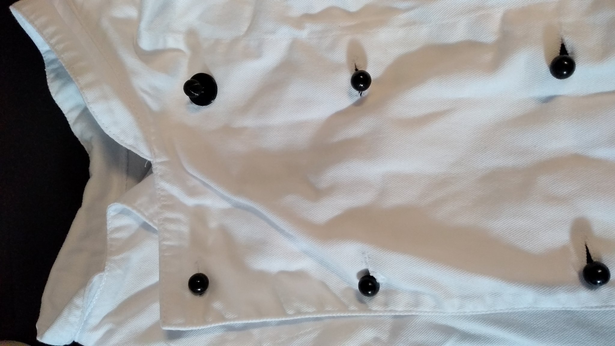 Nút áo cho bếp trưởng trong thiết kế thời trang