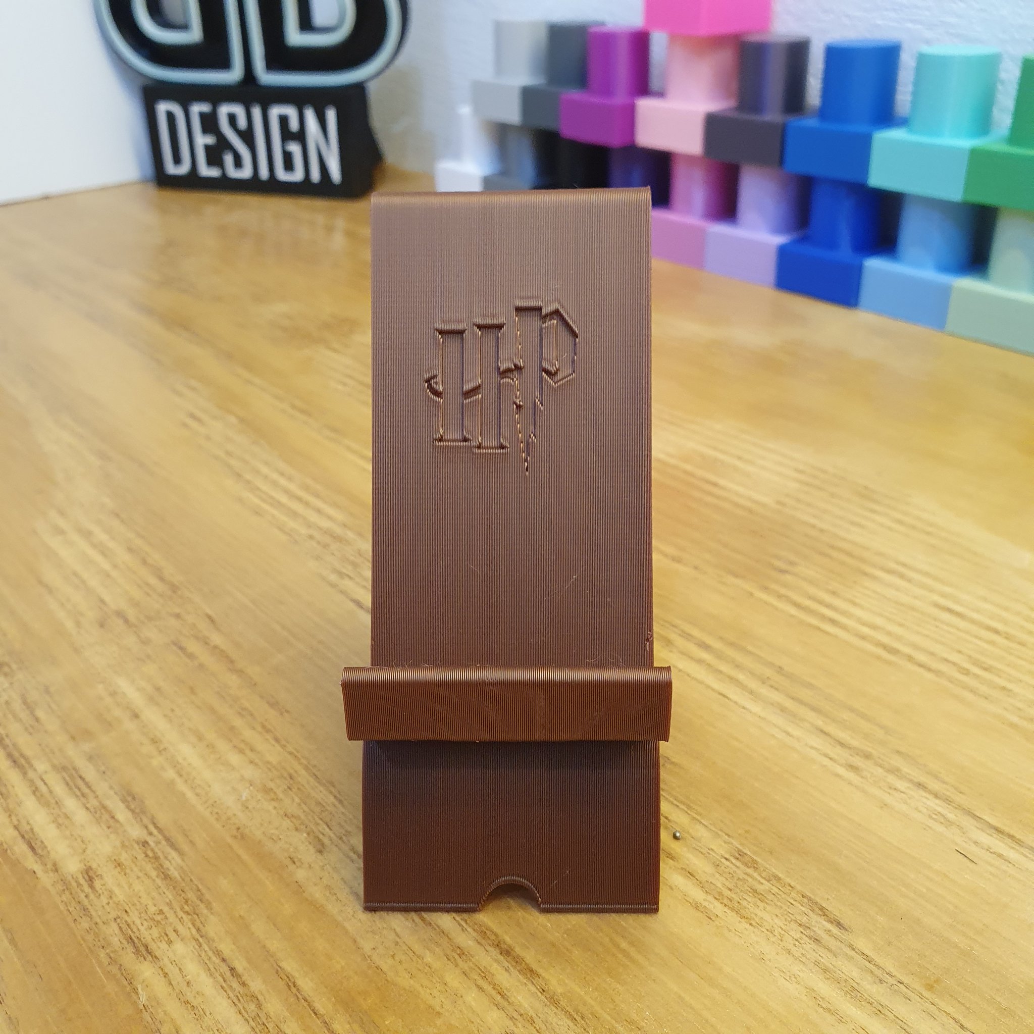 Giá đỡ điện thoại có logo Harry Potter