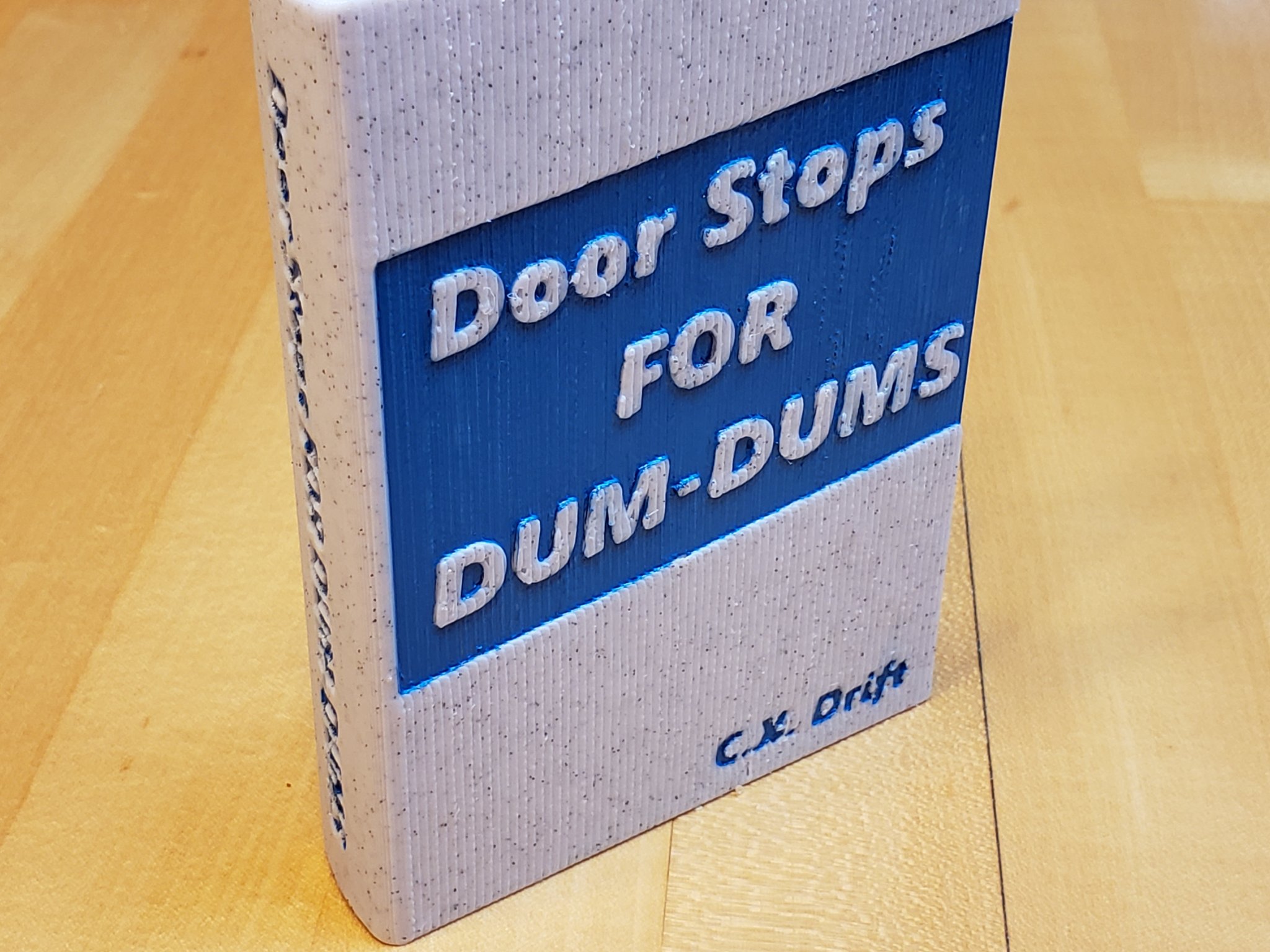 Đế chặn cửa hài hước cho Dum-Dums