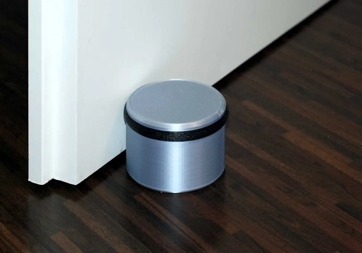 Chặn cửa hình trụ đổ đầy sỏi để tăng trọng lượng và ...