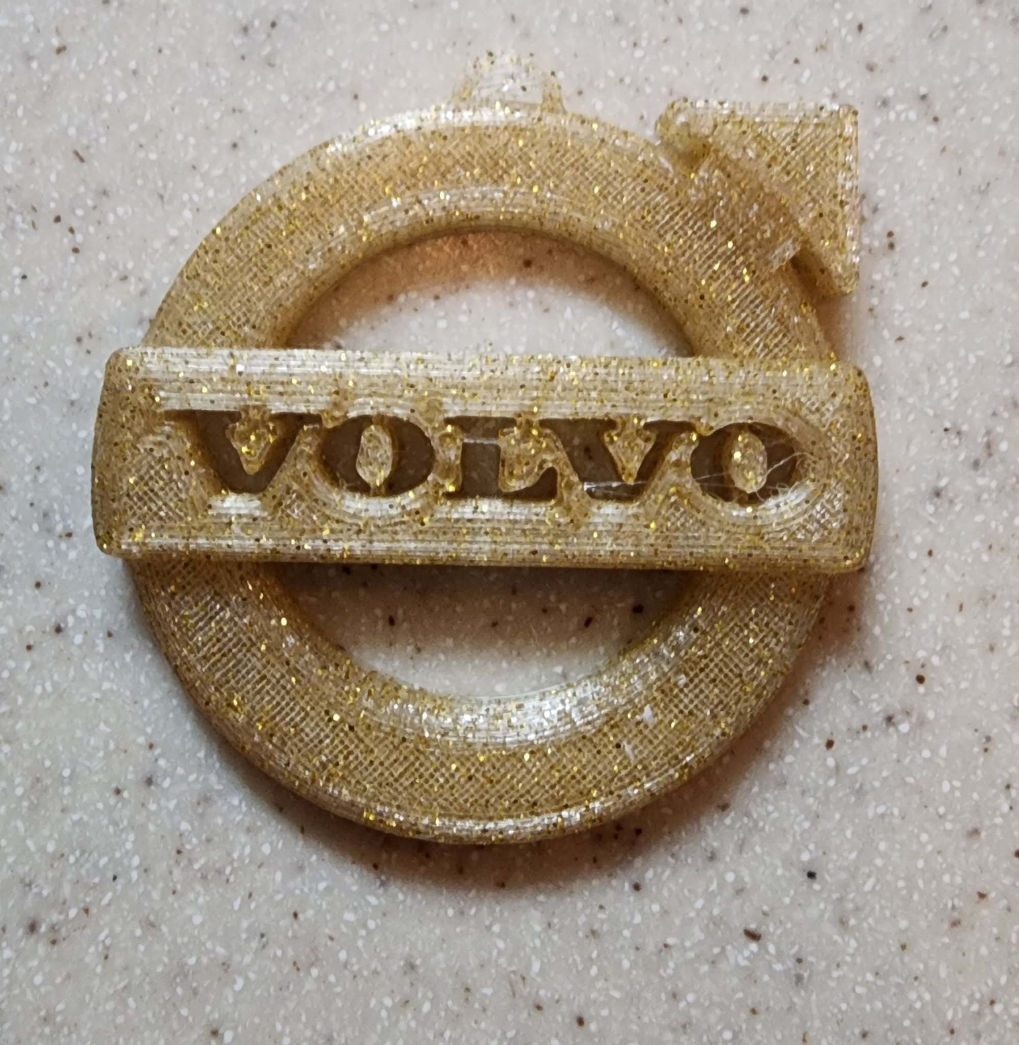 Biểu tượng xe hơi Volvo dùng làm móc chìa khóa hoặc trang trí