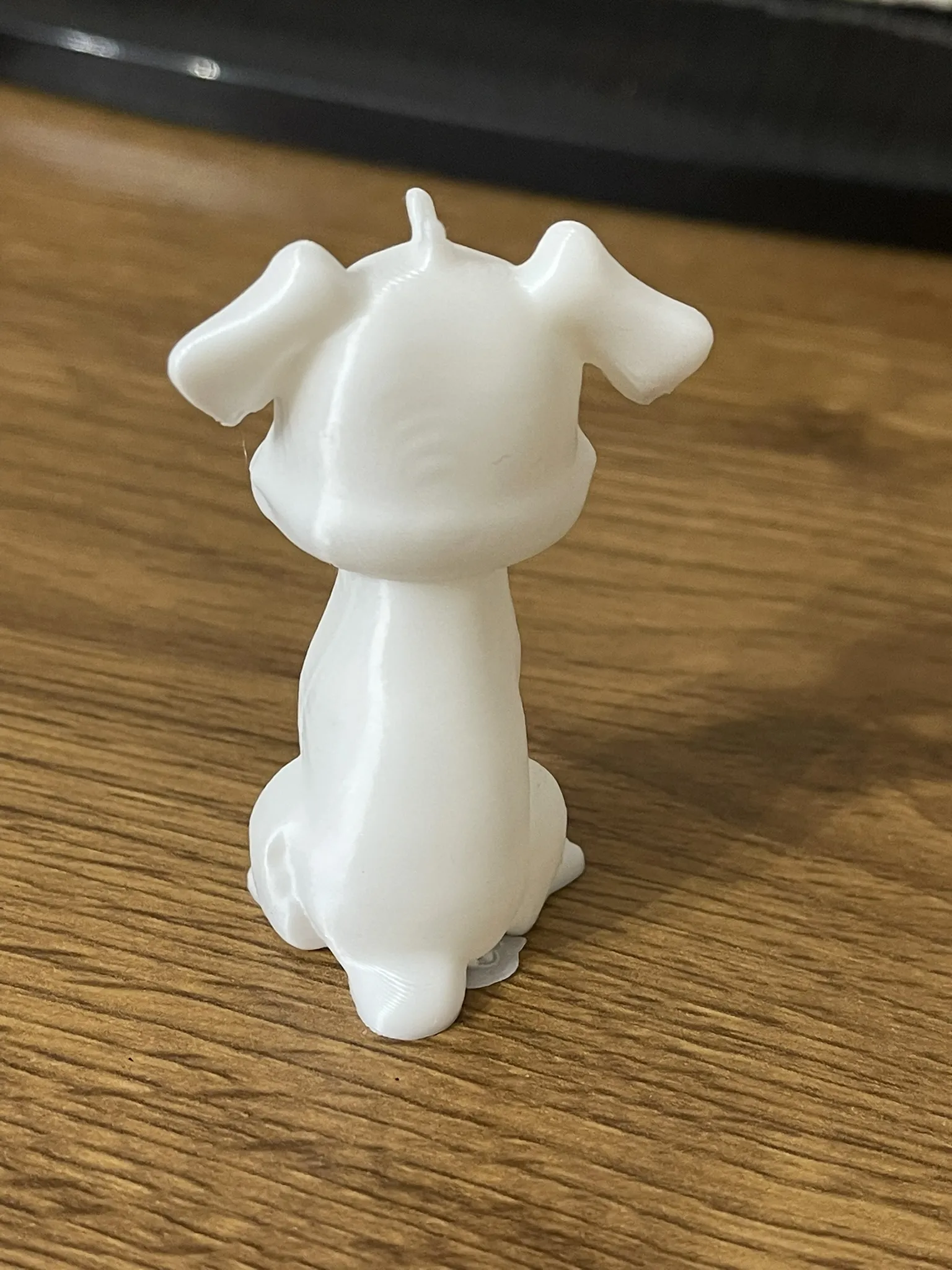 Mô hình chó ngồi chuẩn bị sơn tay