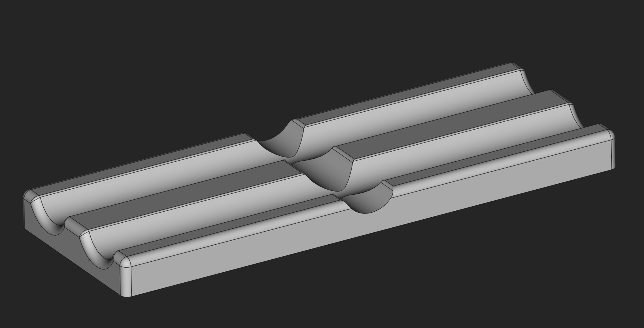 Khay để hai bút mực trên bàn làm việc