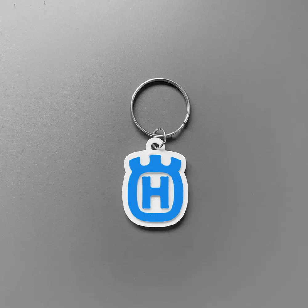 Móc khóa logo Husqvarna in 3D thiết kế đơn giản