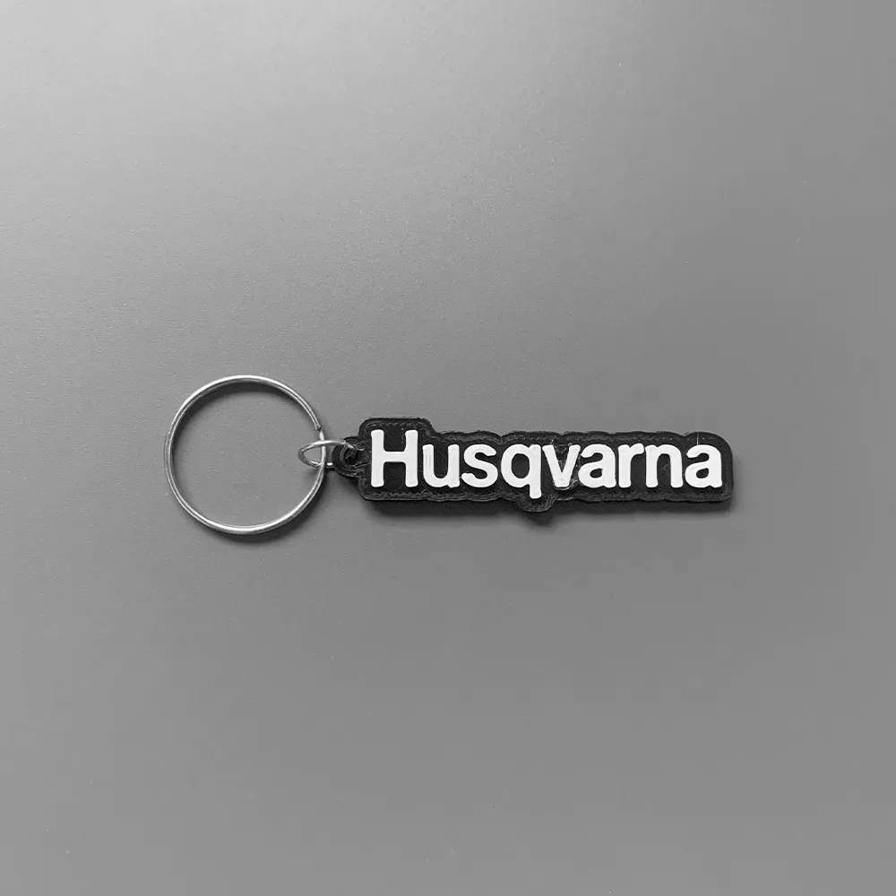 Móc khóa thương hiệu Husqvarna in 3D với thiết kế đơn giản