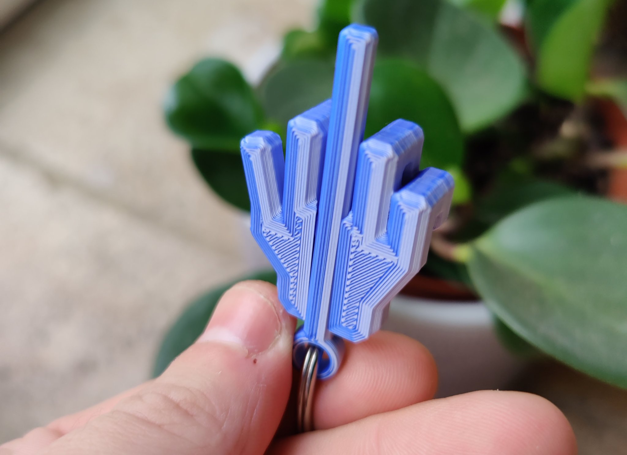 Chìa khóa đeo tay hình ngón giữa vui nhộn