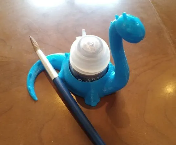 Giá đỡ bình sơn hình khủng long dễ thương