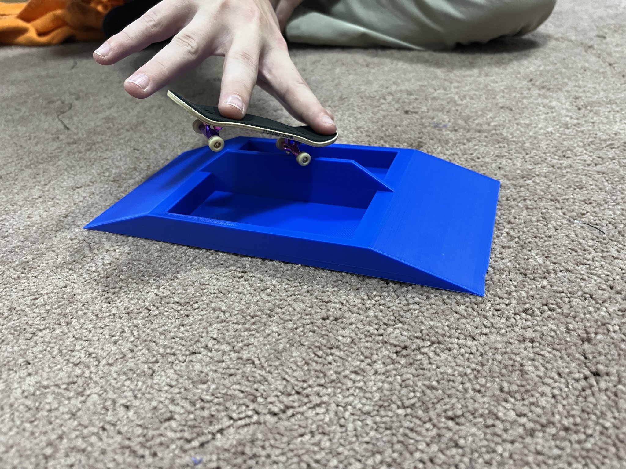 Fingerboard Ramp with rail, gap, and planter