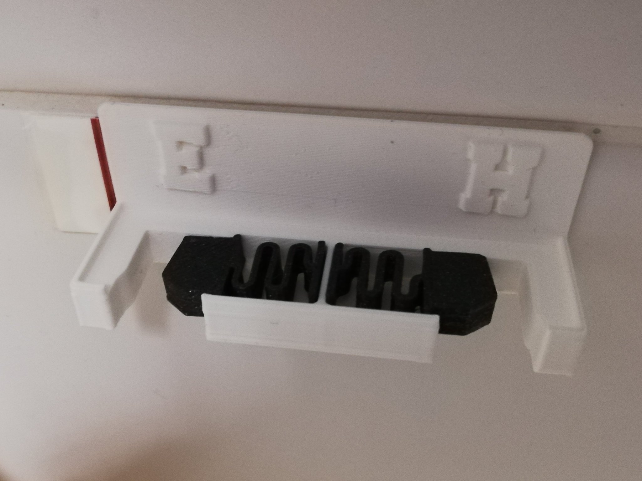 Holder for toothbrushes to be mounted on a wall