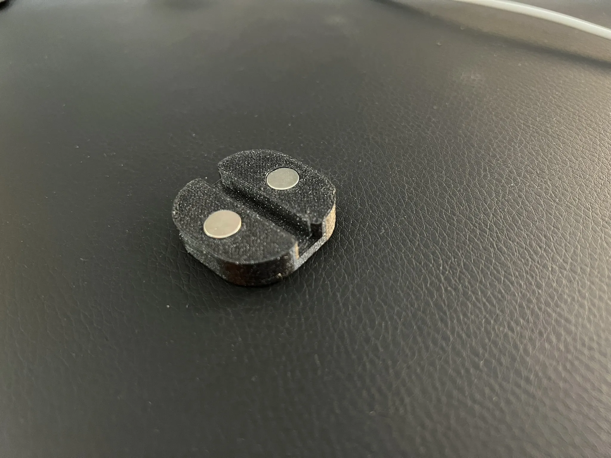 Magnetic cable holder for Secret Lab desks or other magnetic tables