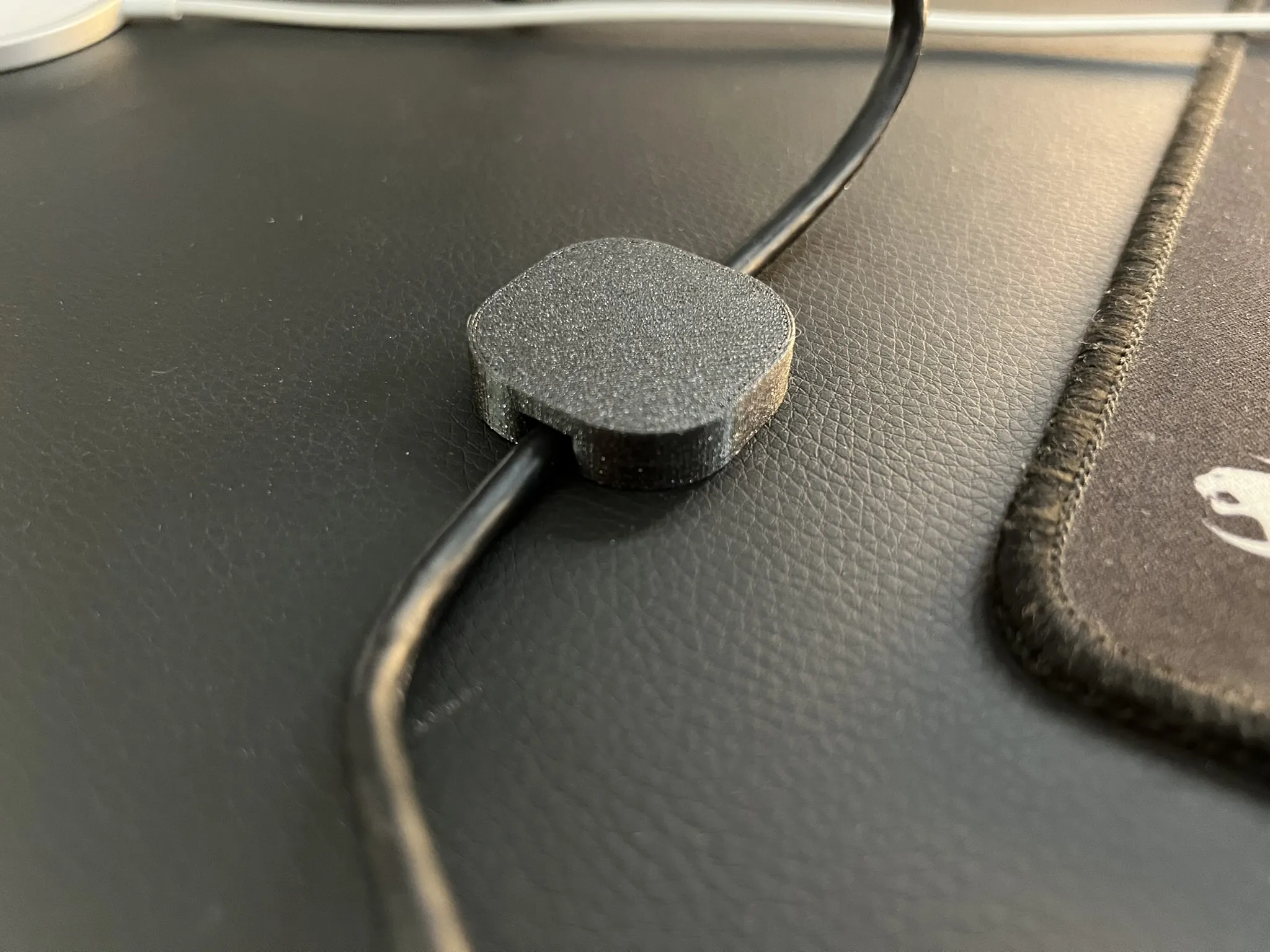 Magnetic cable holder for Secret Lab desks or other magnetic tables