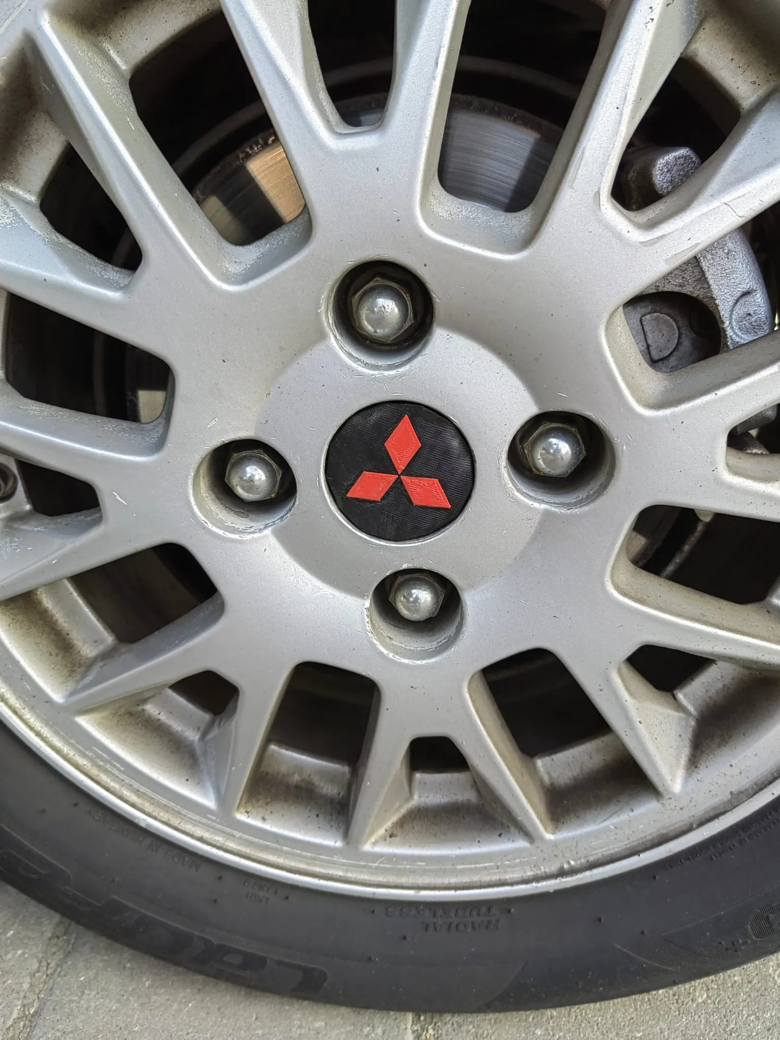 mitsubishi carisma tire rim logo