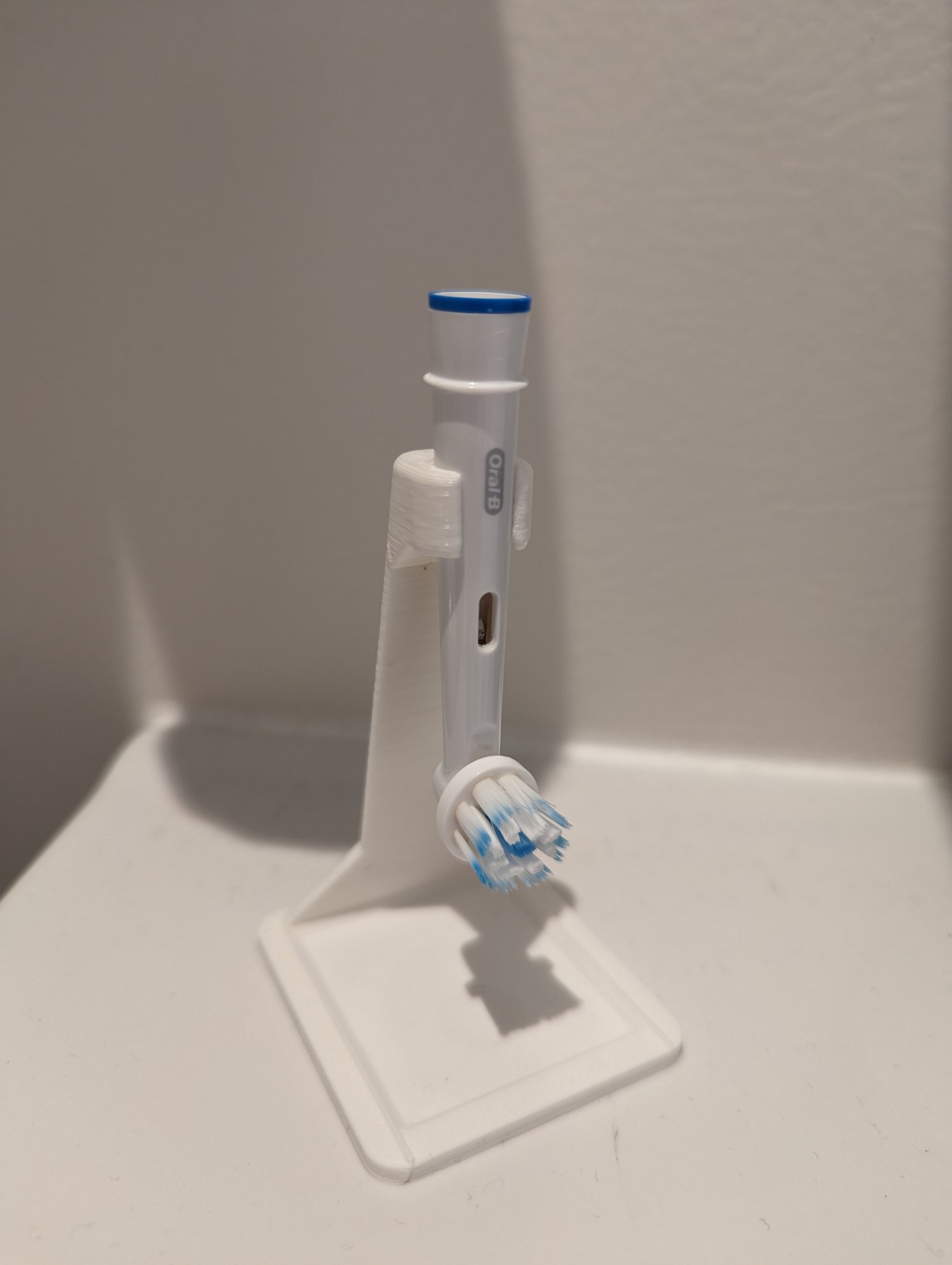 Oral b head stand with dripping tray.