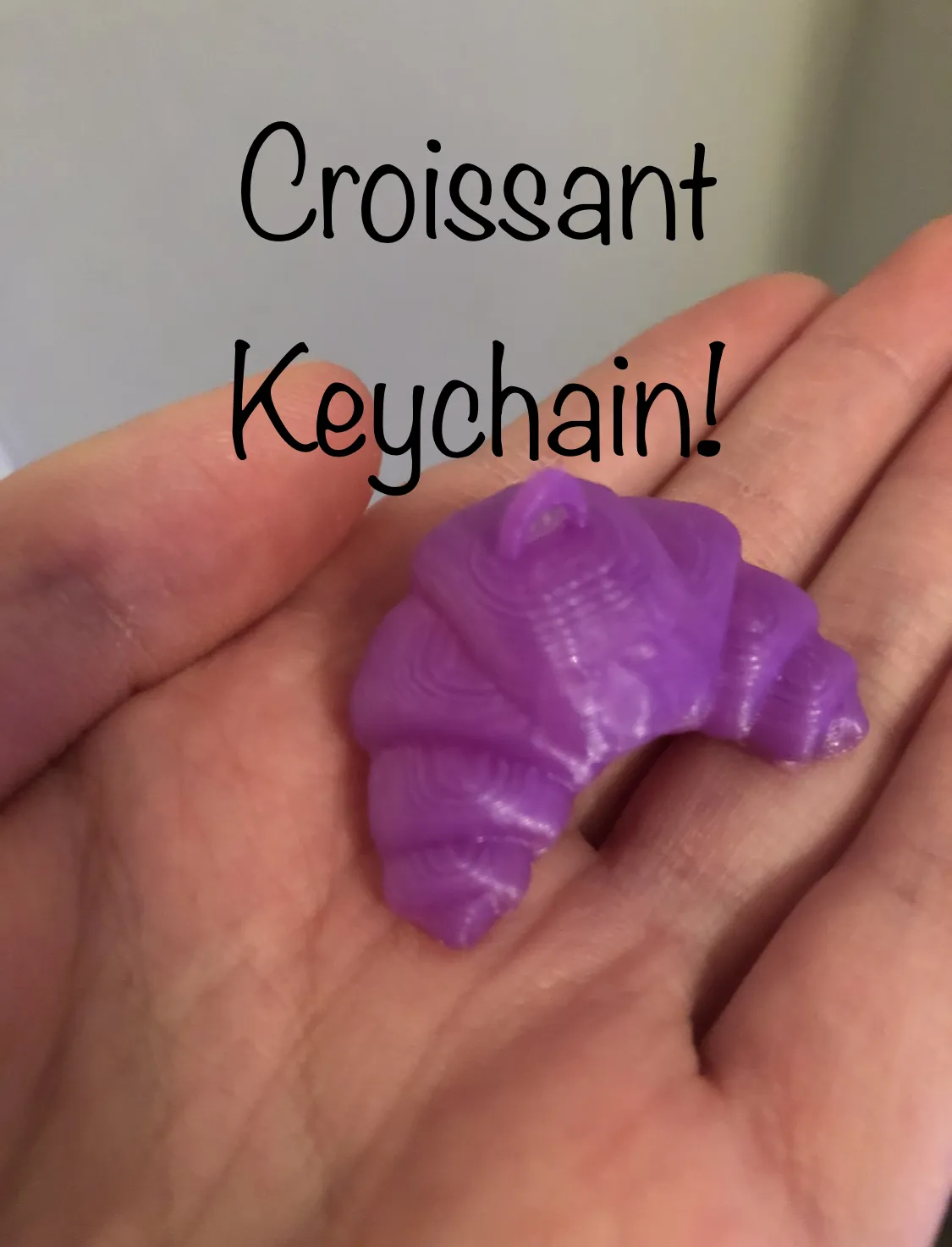 Tiêu đề Puffy Croissant Móc Khóa Tóm tắt Một chiếc móc khóa ng