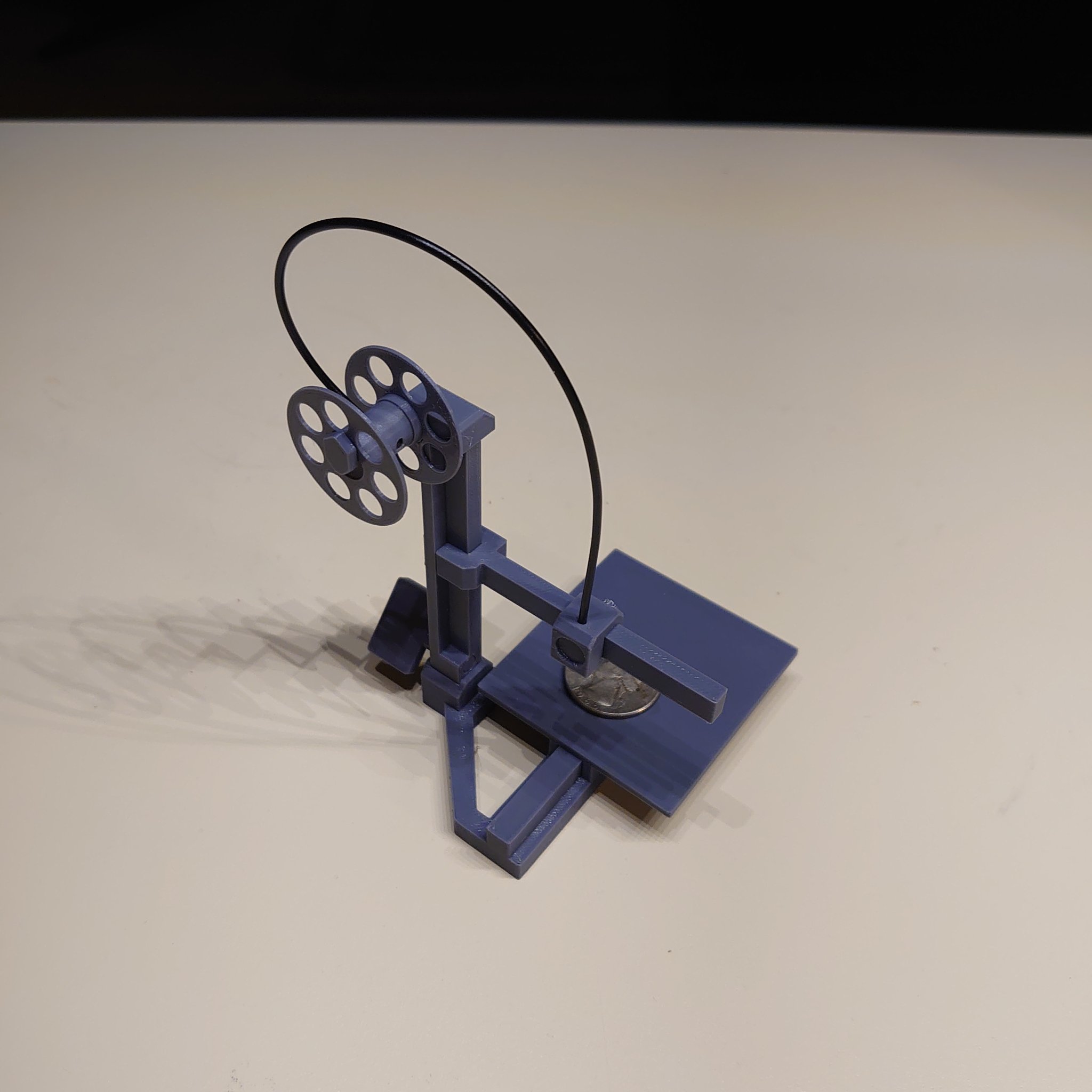 Toy model of a cantilever bed slinger