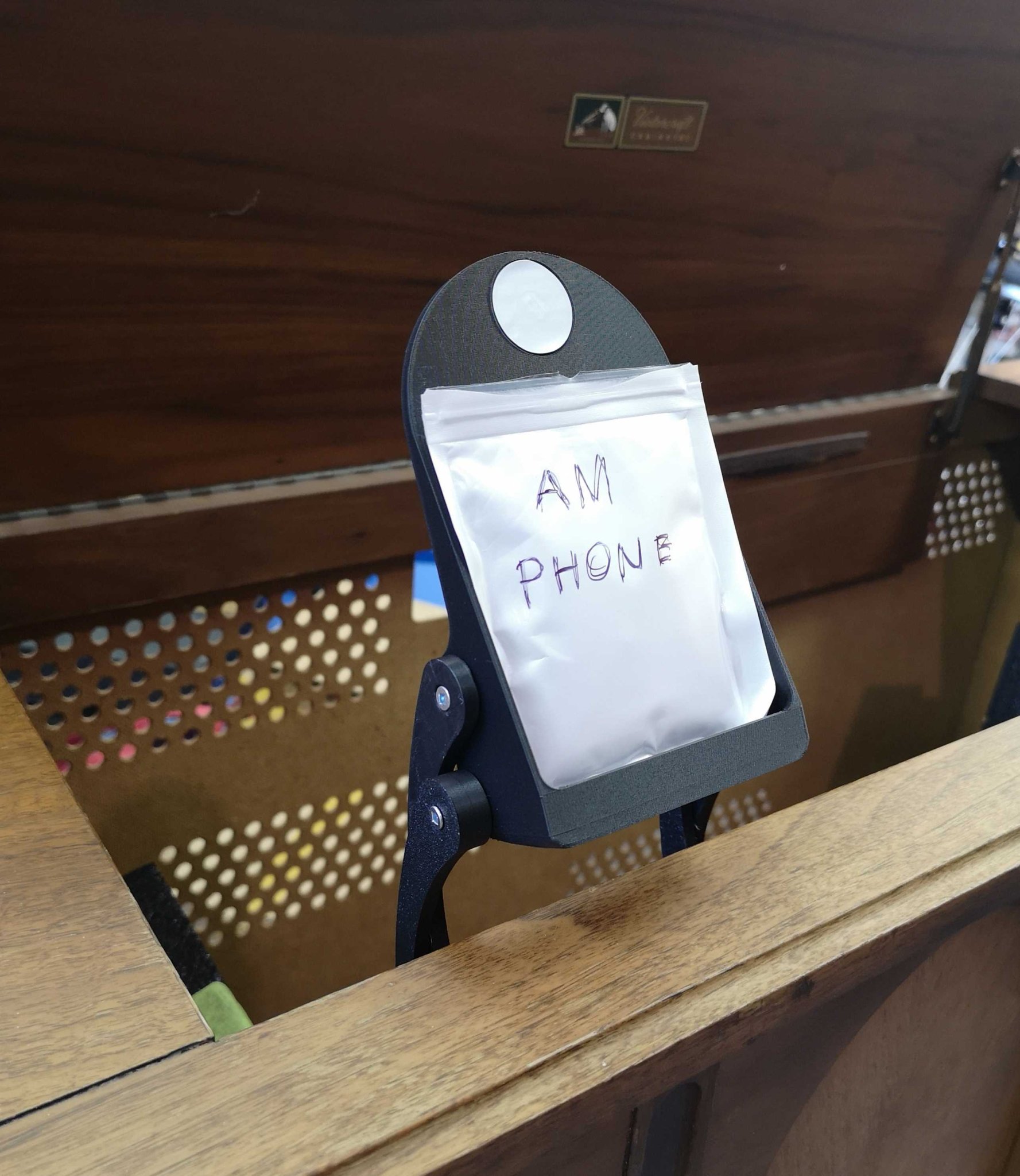 "Stow-away" Cantilevered Phone Stand with NFC tag recess and magnetic position lock