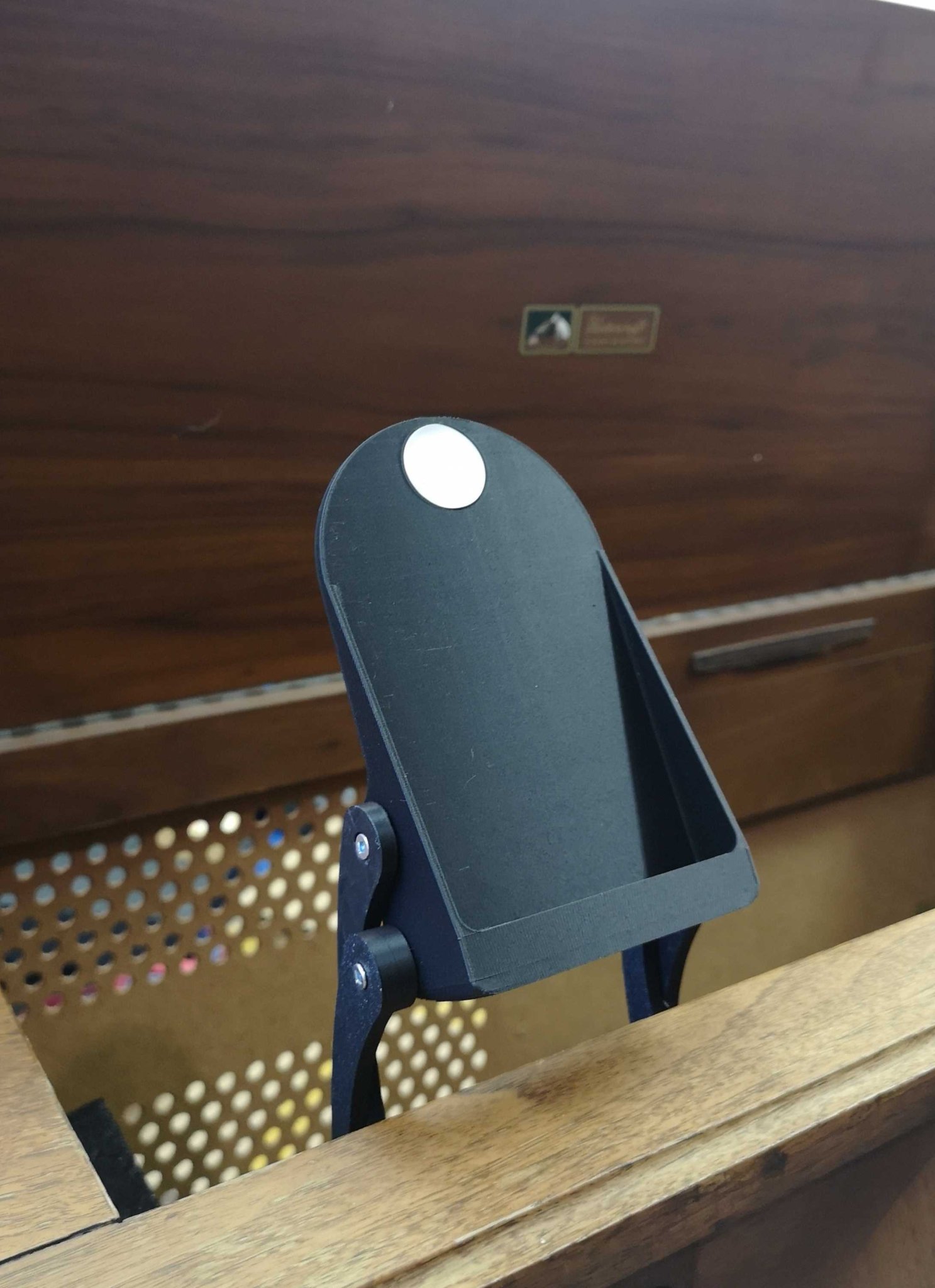 "Stow-away" Cantilevered Phone Stand with NFC tag recess and magnetic position lock