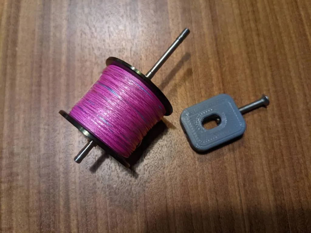 Dụng cụ tháo chốt trục cuộn dây câu cá