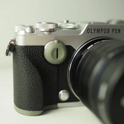 Ốp Tay Cầm và Nắp Vặn Máy Ảnh Olympus Pen-F