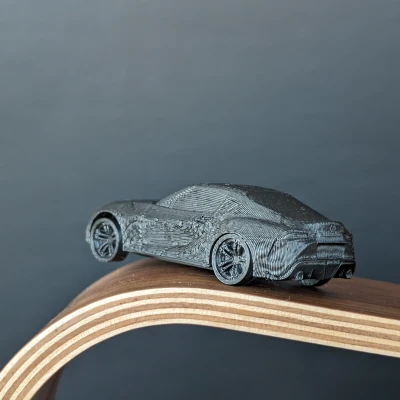 Mô Hình Toyota Supra A90 In Liền Kèm Bánh Xe Quay