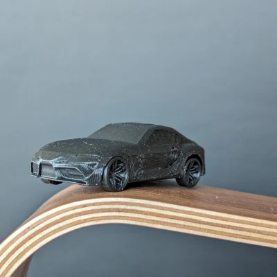 Mô Hình Toyota Supra A90 In Liền Kèm Bánh Xe Quay