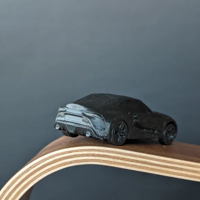 Mô Hình Toyota Supra A90 In Liền Kèm Bánh Xe Quay