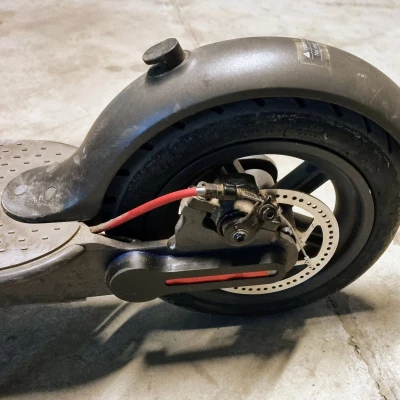 Giá đỡ "AirTag" / mili mittag Khỉ Bạc Tàng Hình cho xe Xiaomi M365